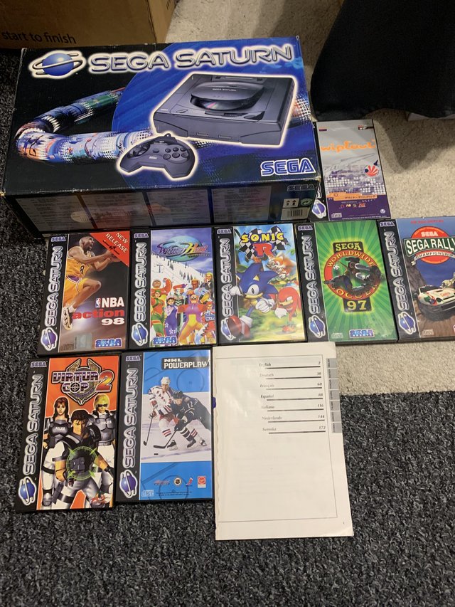 Preview of the first image of Boxed Sega Saturn console with games.