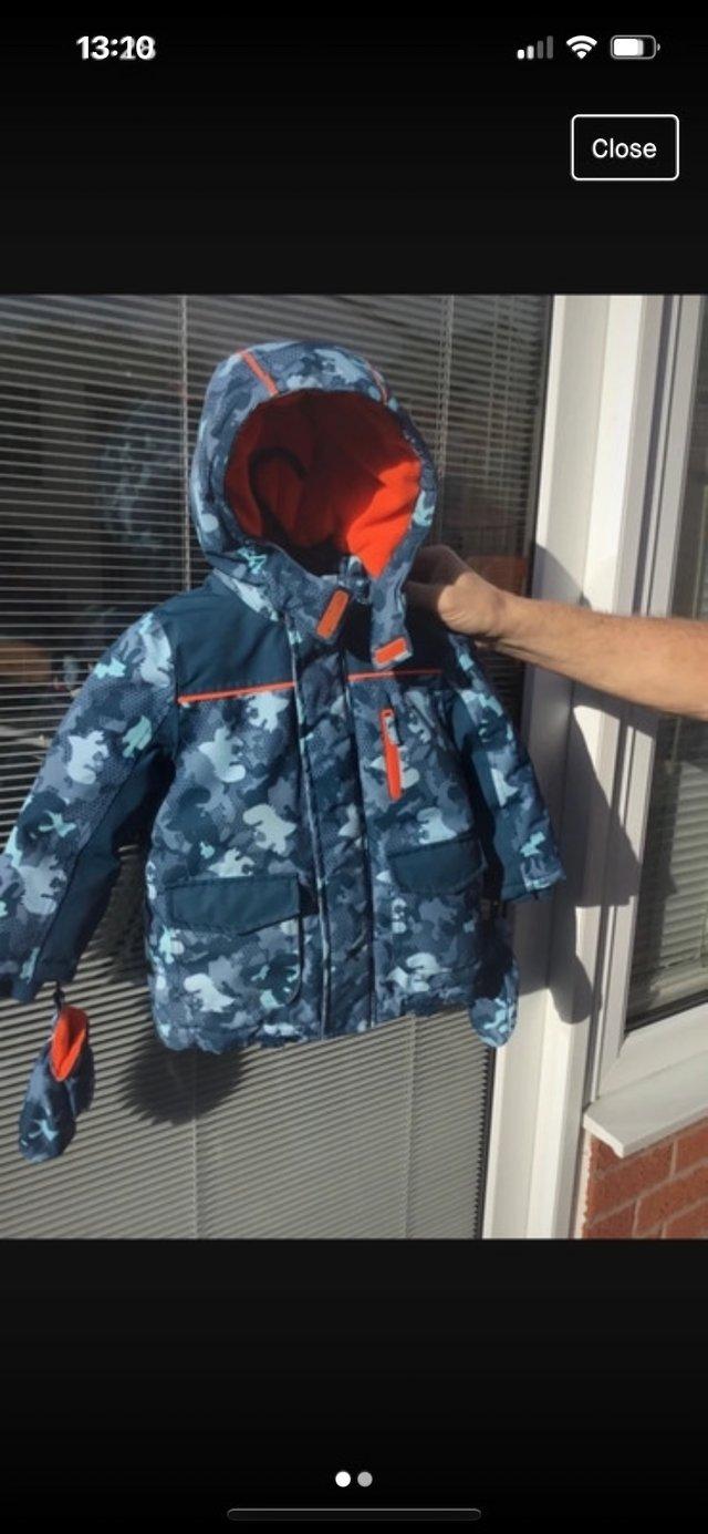 Preview of the first image of Boys winter dinosaur coat with matching gloves age 2-3 yrs.