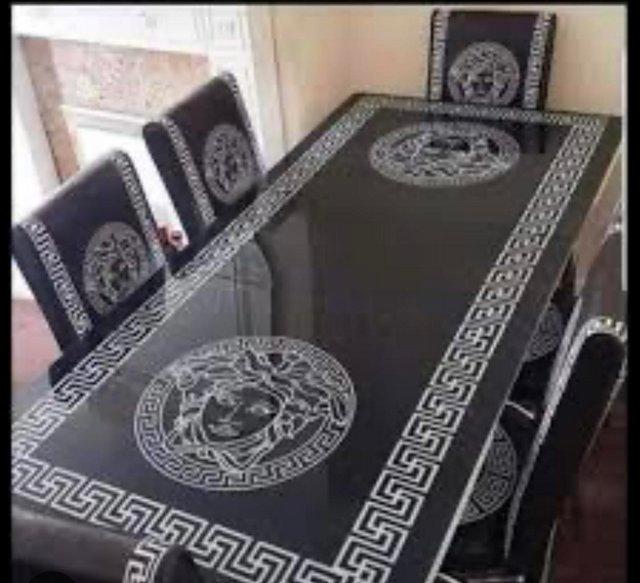 Preview of the first image of Dinning table and five chairs Versace.