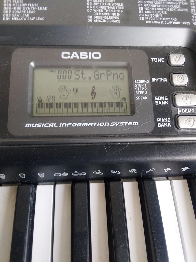 Preview of the first image of Casio keyboard and stand.