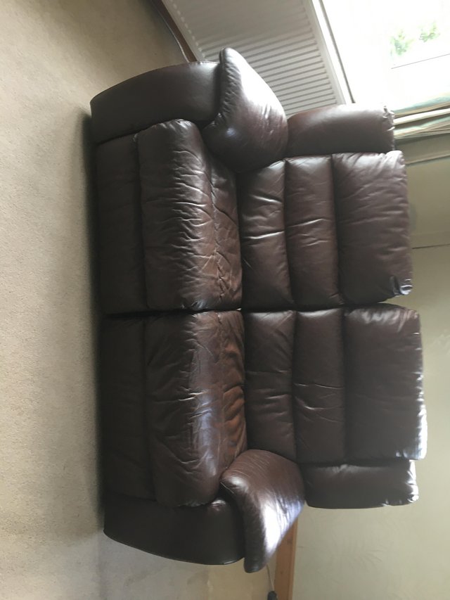 Preview of the first image of Brown Leather sofa powered.