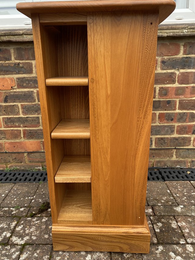 Preview of the first image of Ercol Mural Light Elm Display Cabinet Storage Unit.