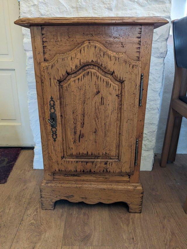 Preview of the first image of Lockable Cabinet in distressed antique pine effect.
