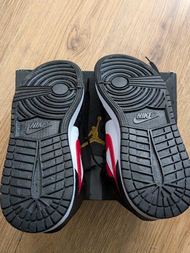 Preview of the first image of Black red and whiteNike air Jordon's.