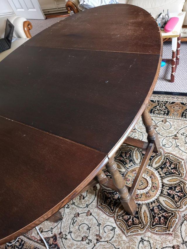 Preview of the first image of Mahogany drop leaf dining table & 4 chairs.