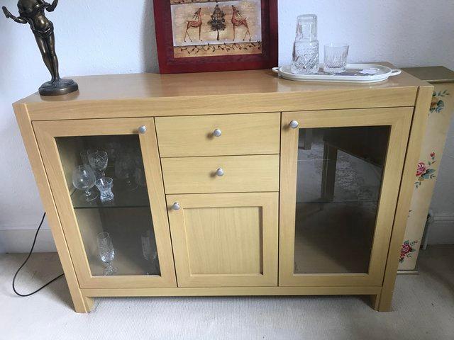 Preview of the first image of Light oak? sideboard with 2 drawers & 2 glass display doors.