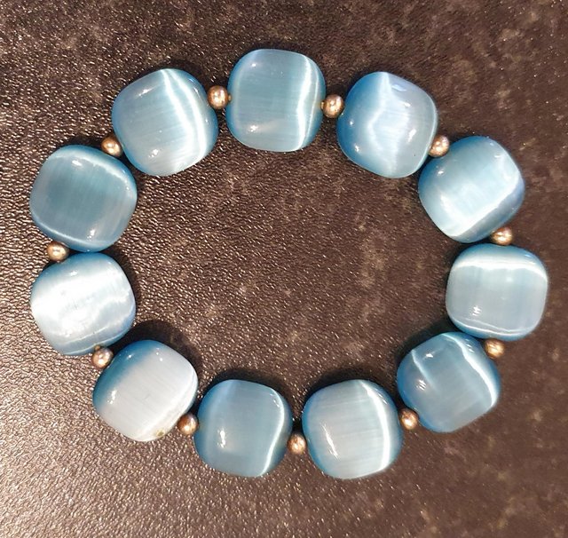 Preview of the first image of Pale blue opaque stretch bracelet.