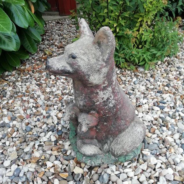 Preview of the first image of Fox statue for garden with cubs made from stone..