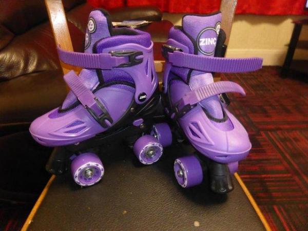 Image 1 of 4 Wheel Roller Boots for sale for sale.