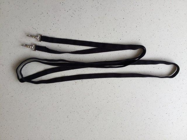 Preview of the first image of Training reins - black draw reins.