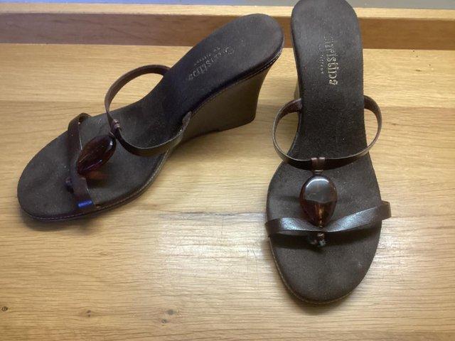 Preview of the first image of Pair of Ladies wedge heeled sandals.