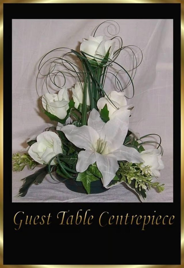 Preview of the first image of 9 Kelly Ivory Wedding Flowers Top Table Decorations.