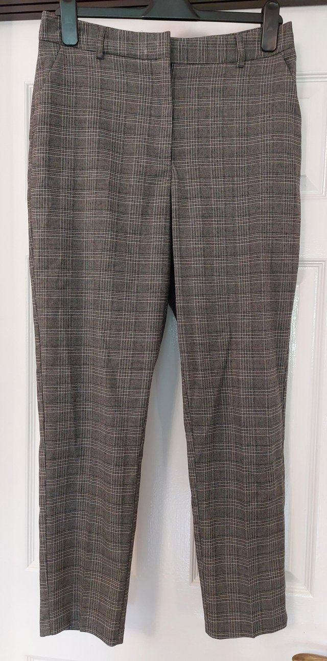 Preview of the first image of Primark grey checked trousers size 12.