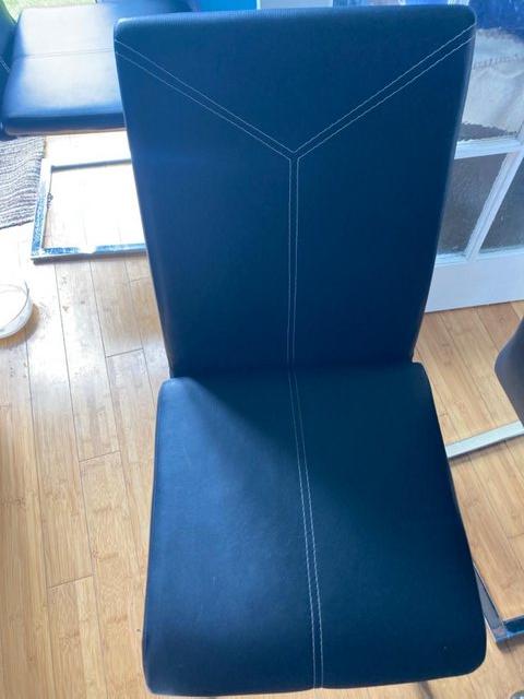 Preview of the first image of Black leather dining room chairs.