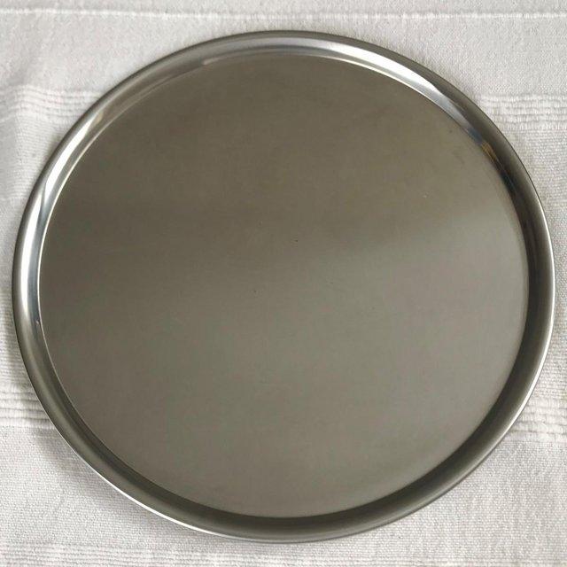 Preview of the first image of Vintage Spring, Switzerland round stainless steel tray..