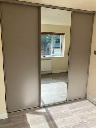 Image 2 of Set of three sliding doors with full height mirrored door