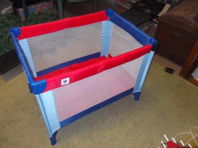 Preview of the first image of Childs cot in as new condition.