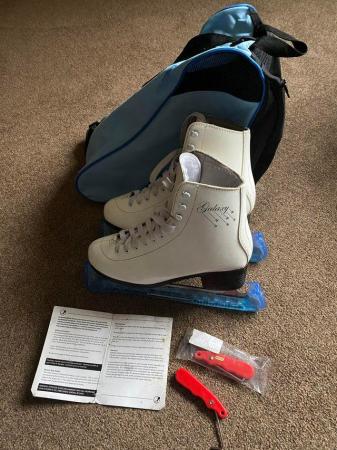 Image 2 of Size 7 white ice-skates with accessories