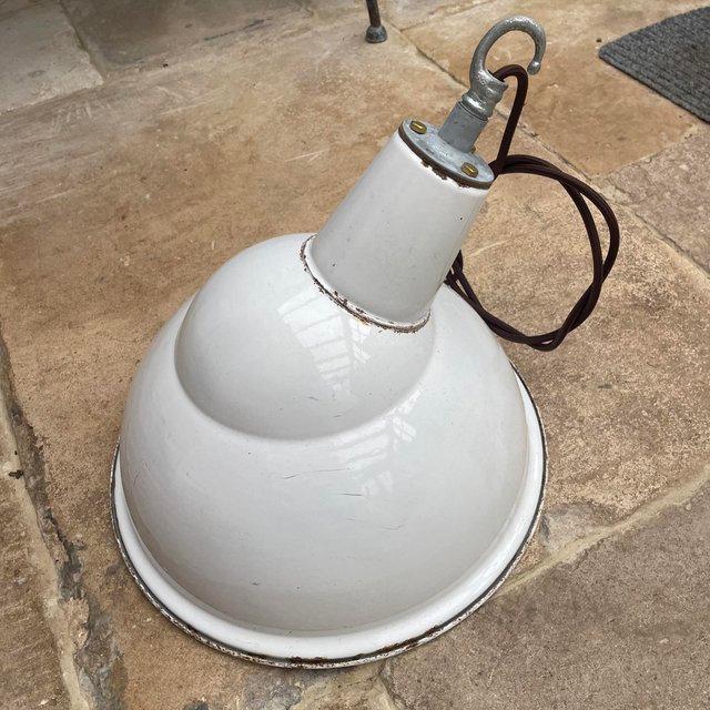 Preview of the first image of A large vintage industrial enamel light.