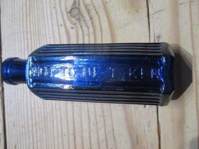 Preview of the first image of Blue Antique Apothecary hexagon glass bottle.