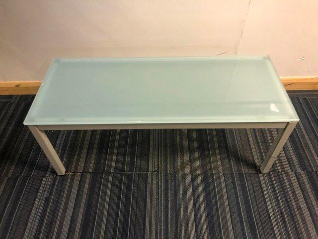 Preview of the first image of 3 Blue hued glass office tables.