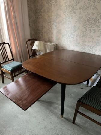 Image 1 of Dining table with extendable leaf