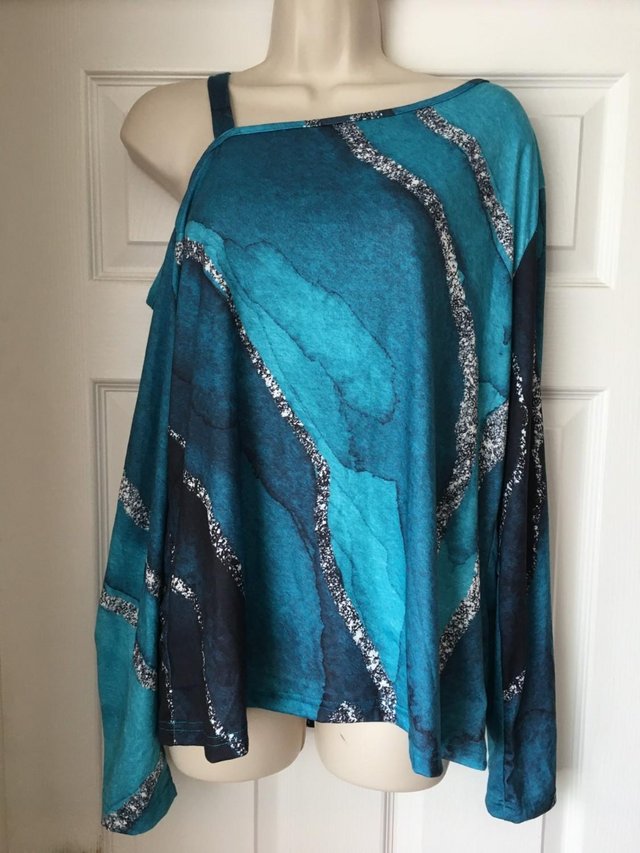 Preview of the first image of Ladies Turquoise Long Sleeved Off The Shoulder Top Size XL.