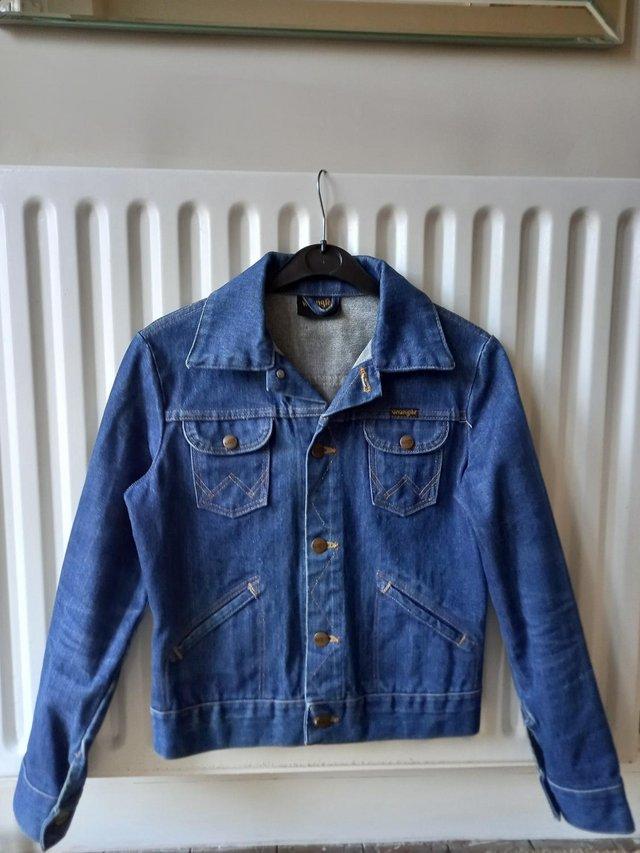 Preview of the first image of Vintage Wrangler denim jacket age 12.