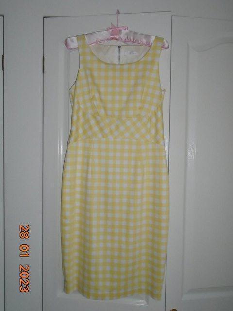 Preview of the first image of Yellow and white checked sleeveless cotton dress.