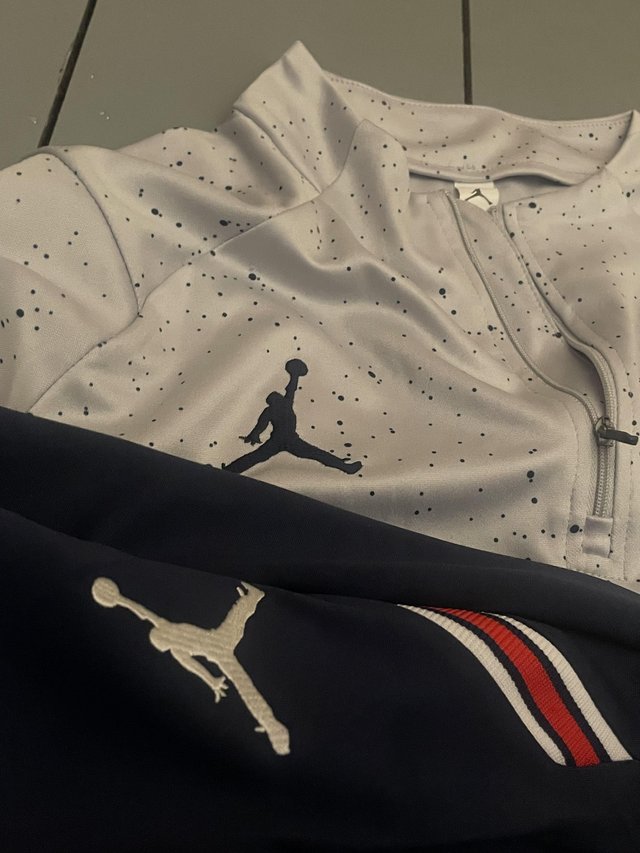 Preview of the first image of Cream PSG X Jordan tracksuit.