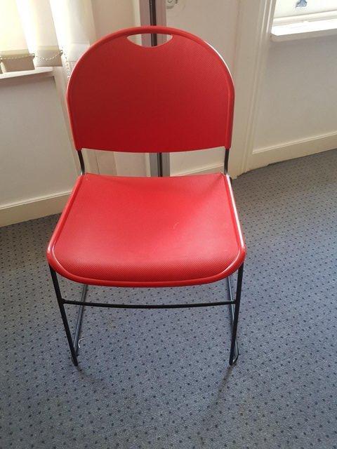Preview of the first image of Stackable Vibrant red cantilever chairs w/footrest £25 each.