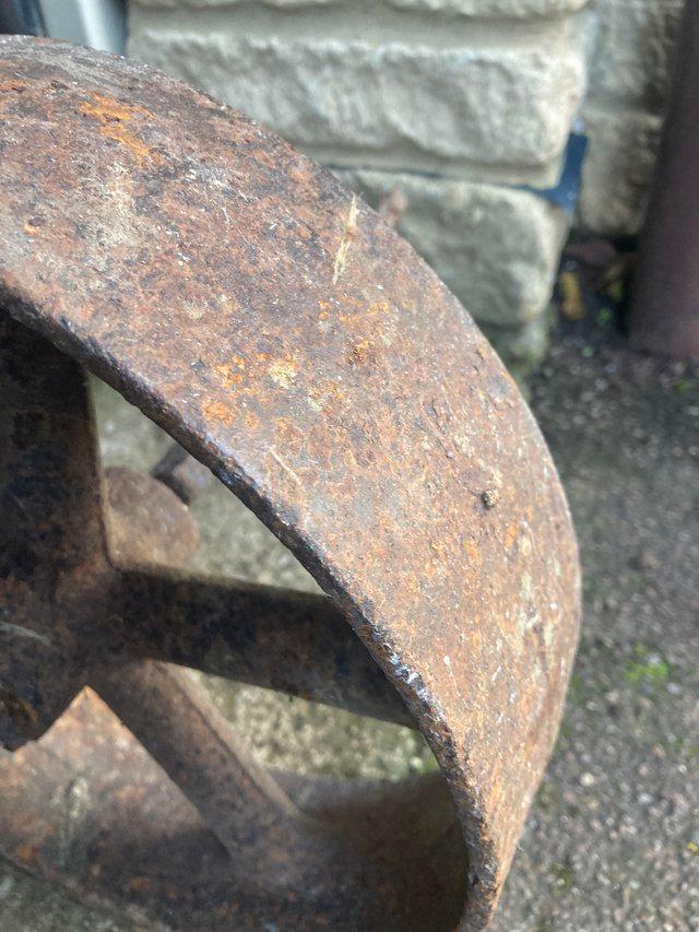 Preview of the first image of Vintage Cast Iron Shepherds Hut Wheel.