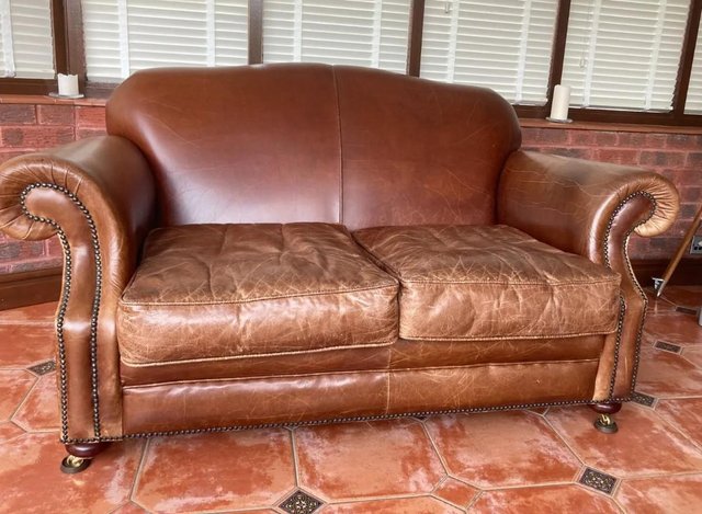 Preview of the first image of Laura Ashley 2 Seater leather settee.