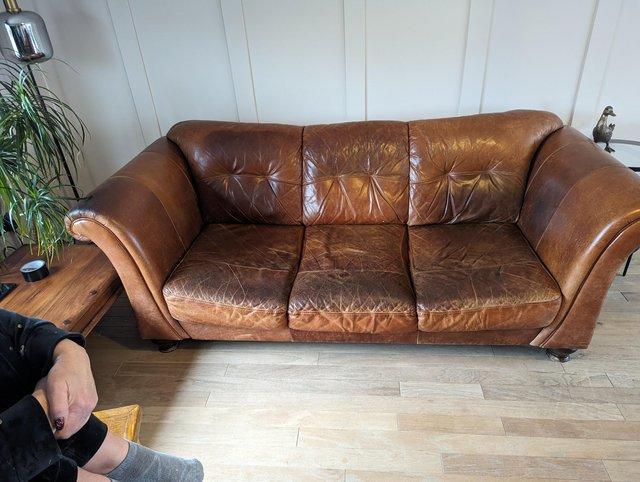 Preview of the first image of Tan leather Sofa and chair for sale.