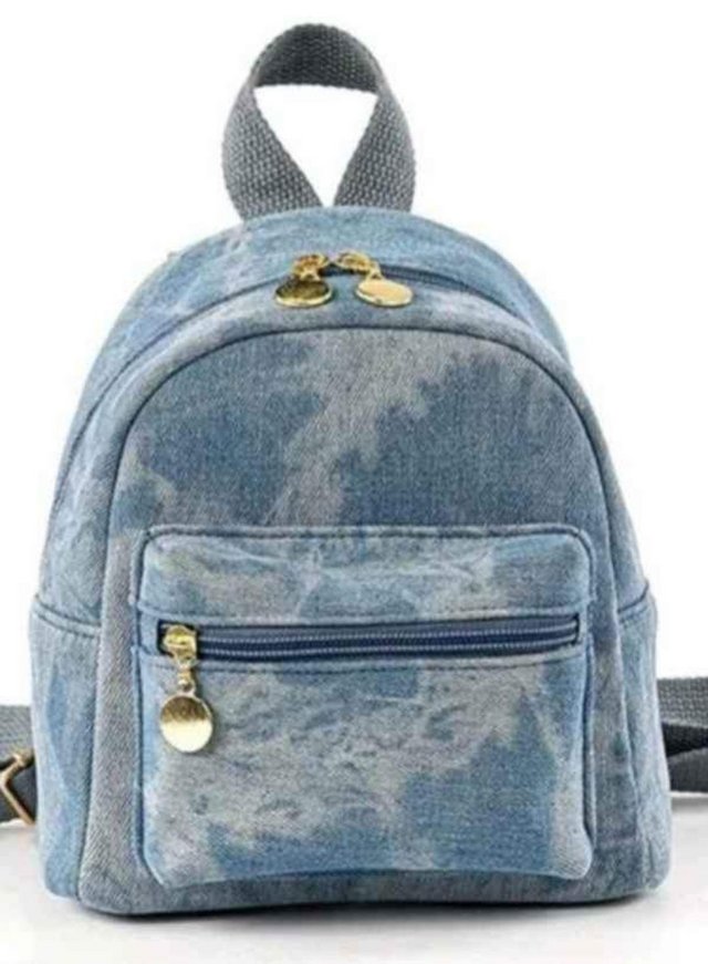 Preview of the first image of Small blue denim backpack.