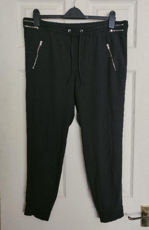 Preview of the first image of Ladies Black Zara Cuff Trousers - Size 12/14.
