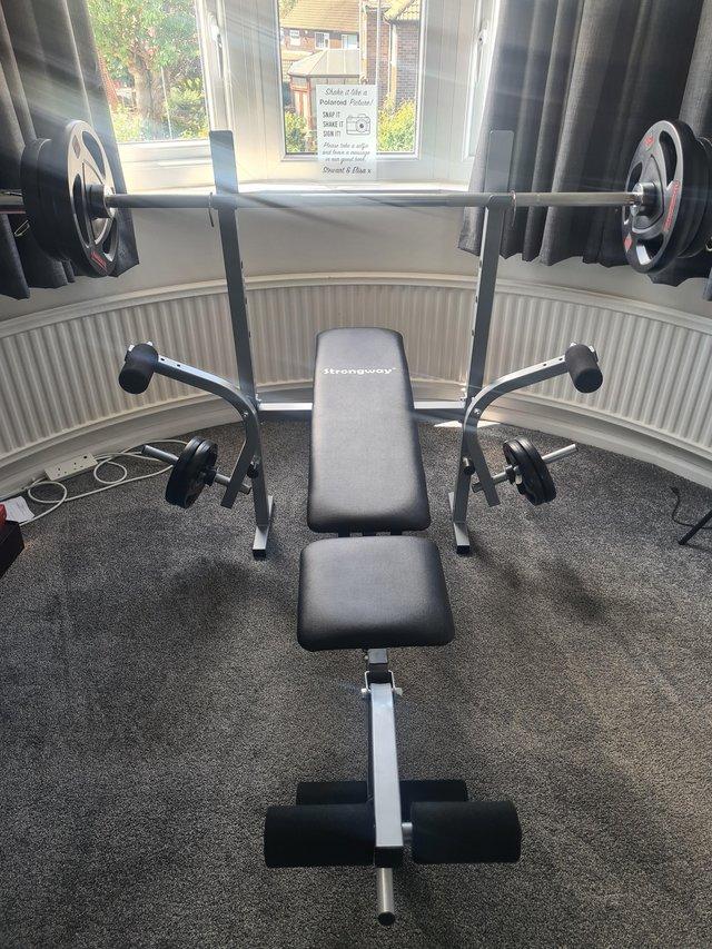 Preview of the first image of Weight bench and Weights.