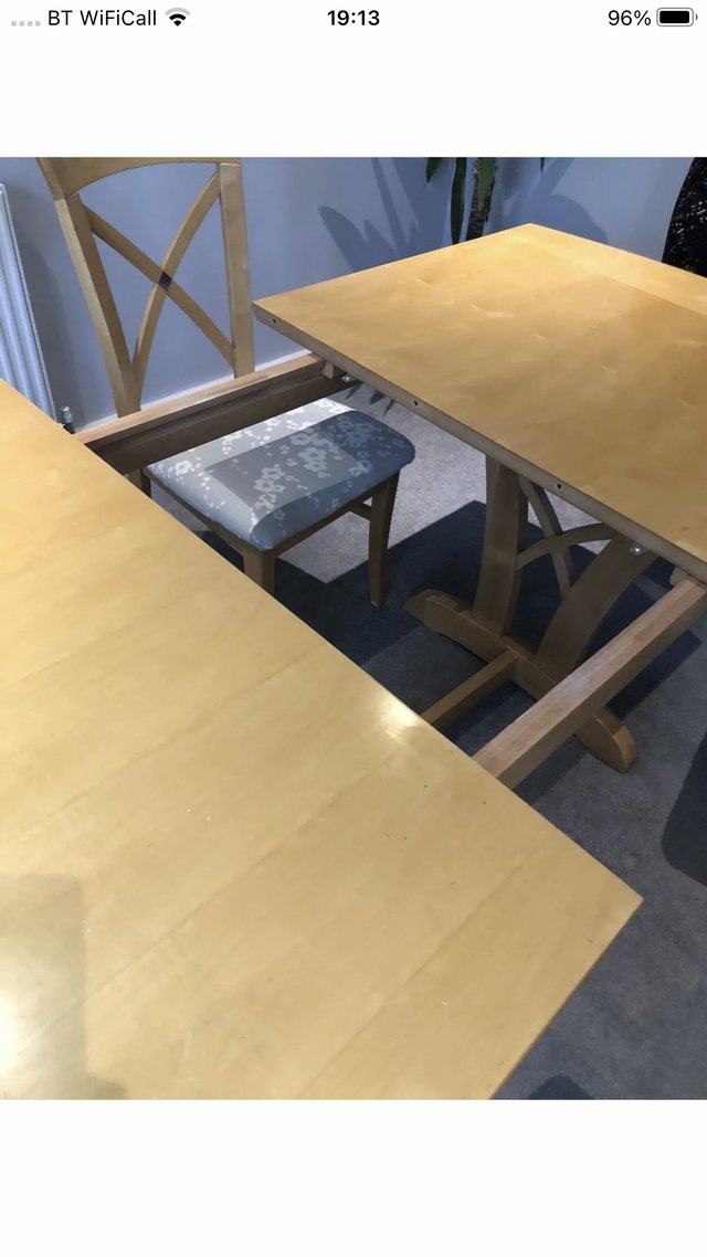 Preview of the first image of Extendable dining table and 6 chairs.