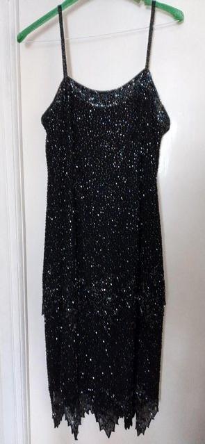 Preview of the first image of Black beaded silk dress size 16.