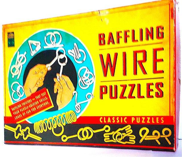 Preview of the first image of LOW USE - BAFFLING WIRE PUZZLES x 12 in ORIGINAL BOX.