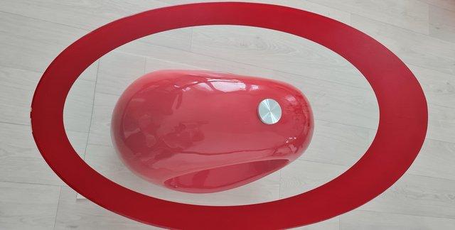 Image 1 of Red oval coffee table from Amazon