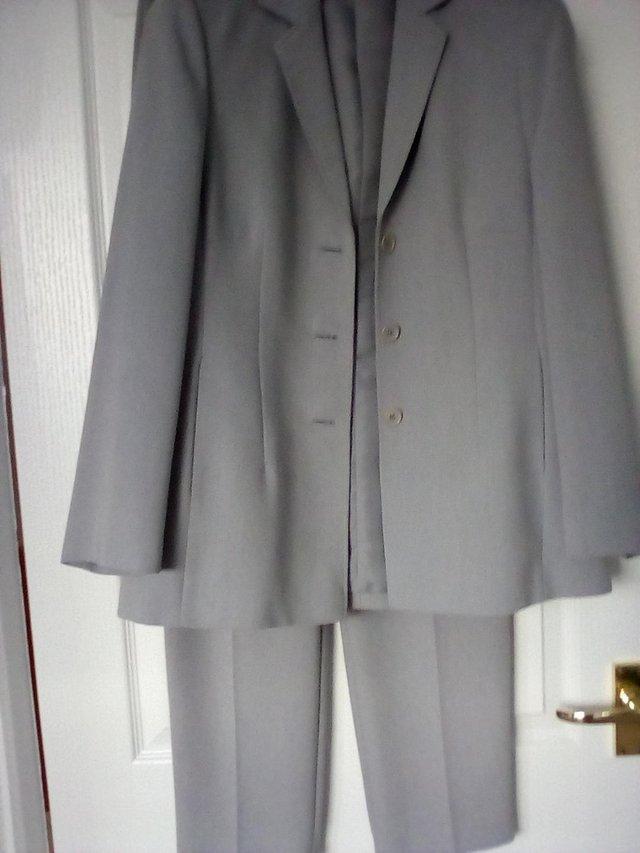 Preview of the first image of Ladies Silver Grey Trouser Suit.