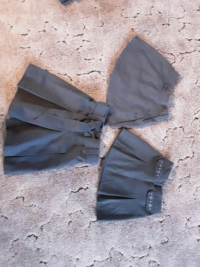 Preview of the first image of Girl's school skirt and shorts age 3-4 years..