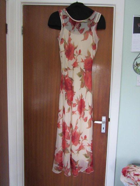 Preview of the first image of Women's Pink and cream dress size 12.