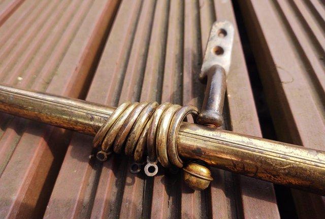 Preview of the first image of Antique Brass Articulated Door Curtain Rail.
