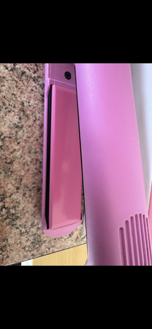 Preview of the first image of Cloud nine pink hair straighteners.