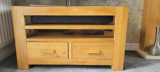 Preview of the first image of Solid oak TV unit with 2 shelves 2 drawers.