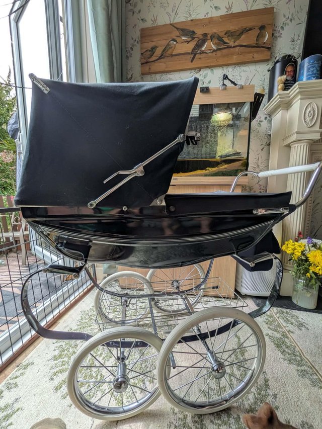 Vintage silver cross dolls pram