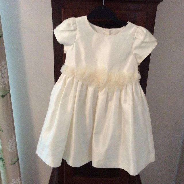 Preview of the first image of BABY GIRL'S OCCASION DRESS 18/24 mths.