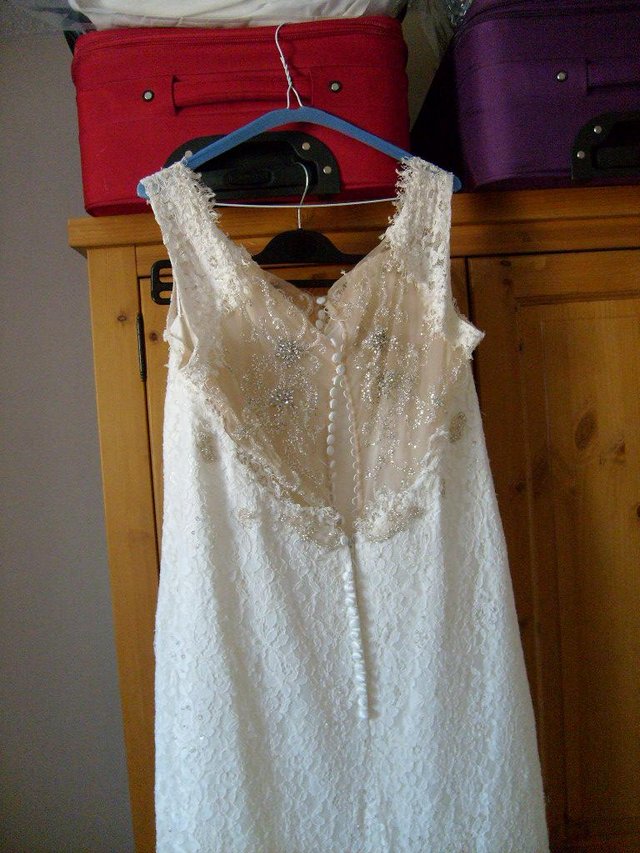 Preview of the first image of Ivory Wedding Dress in a lovely condition..